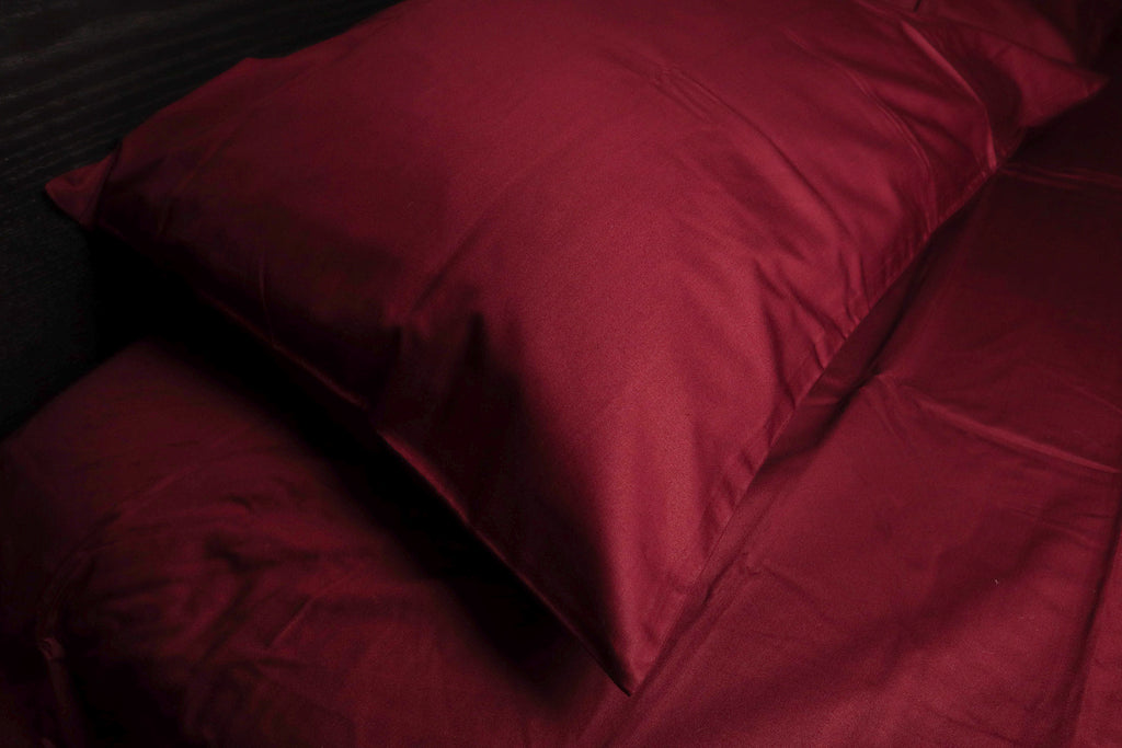 pillow on a bed  with karkadé sheet set
