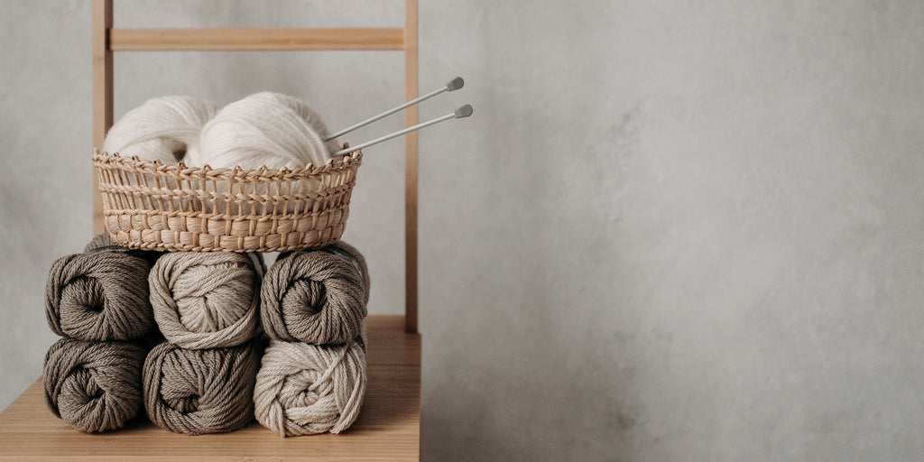 basket of some crochet and a needle