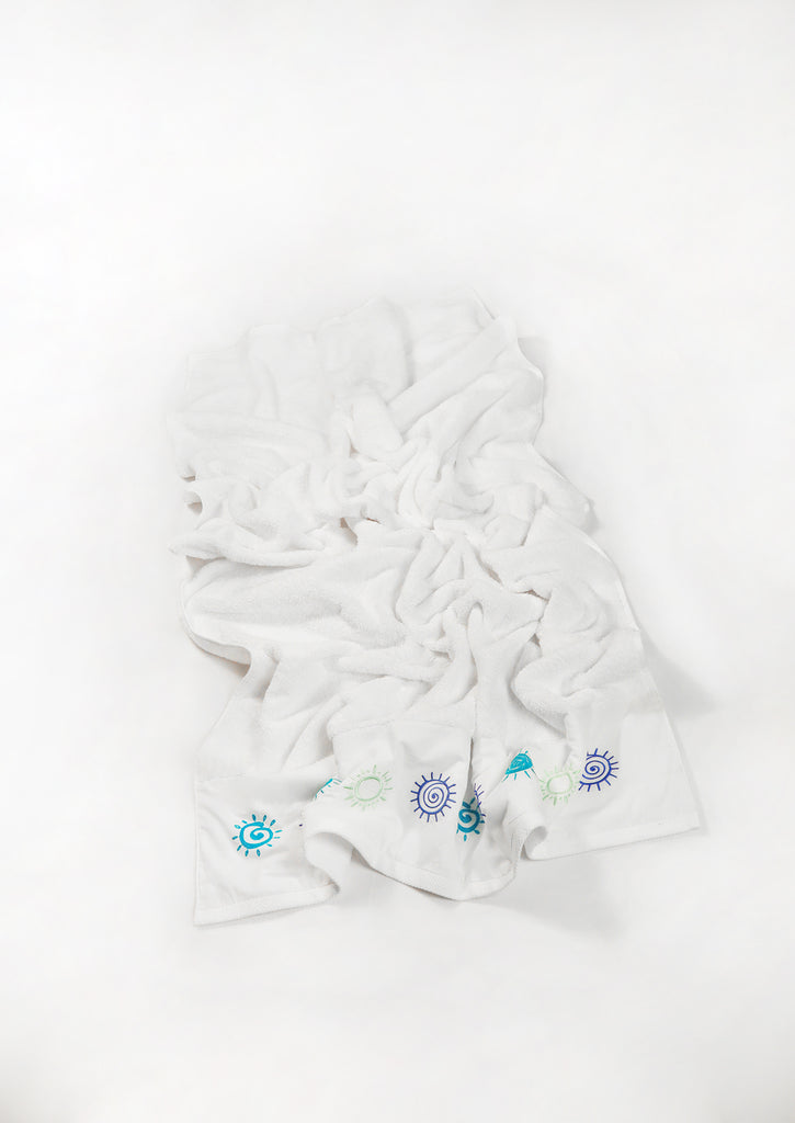 flat lay of embroidered white towel