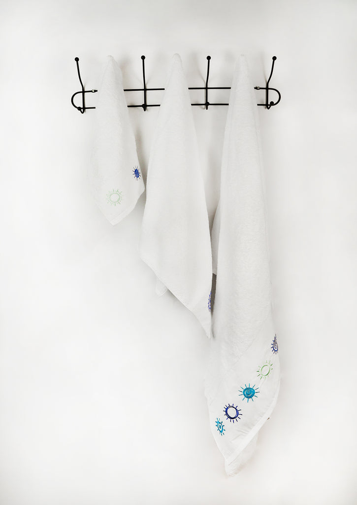 set of 3 embroidered white towels on a hanger