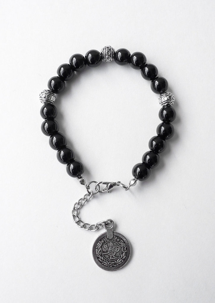 black gypsy coin bracelet on white background