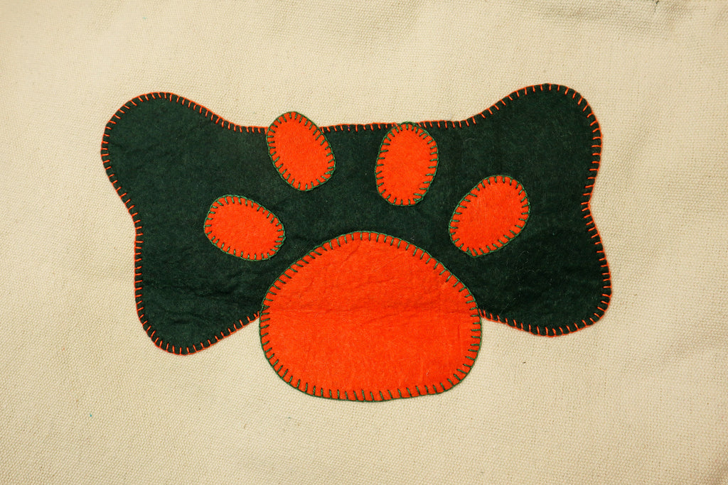 orange | green paw