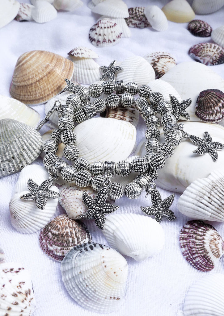 two Starfish Bracelets on sea shells