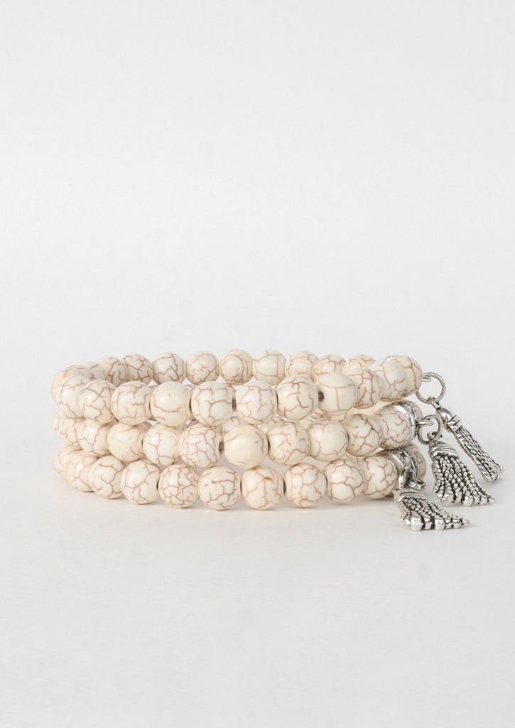 Three cream marble bracelets on white background 