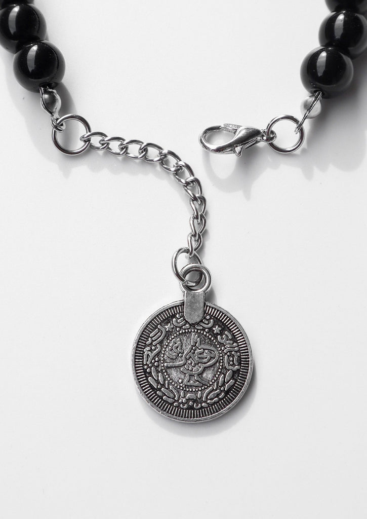 gypsy coin of black bracelet on white background