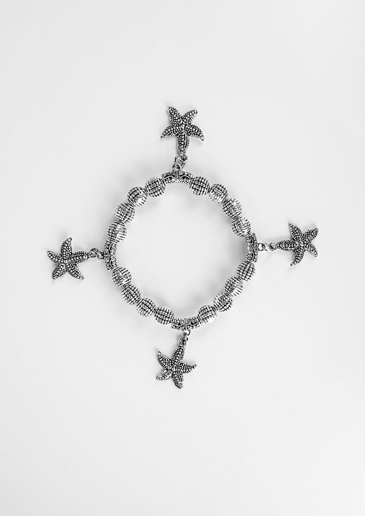 Starfish Bracelet on white background - flat lay