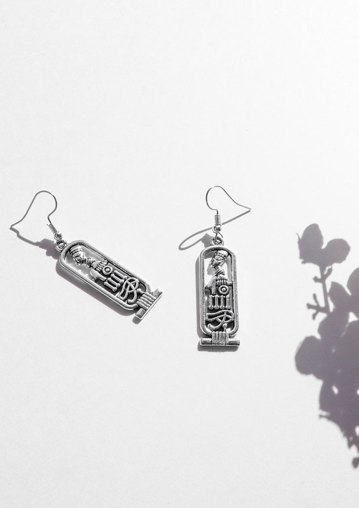 Cartouche Earrings on white background