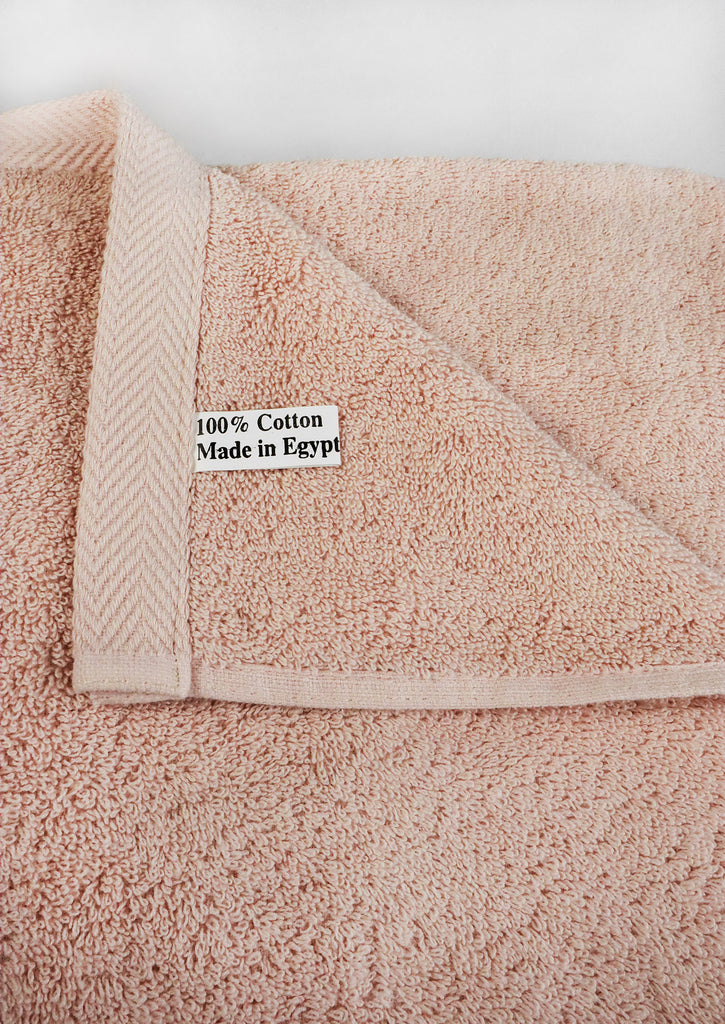 made in Egypt | 100% cotton label stitched to peach towel