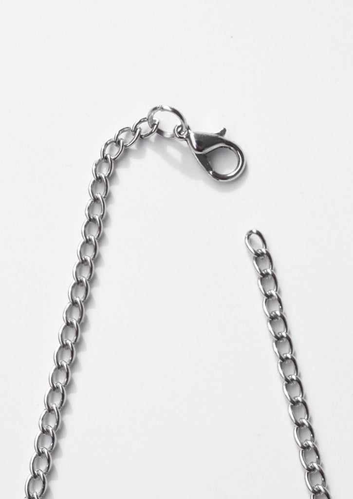 Chain and lobster clasp on white background 