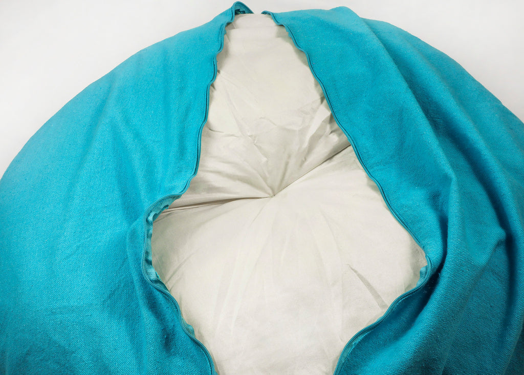 cushion of doughnut bed on white background - opened zipper