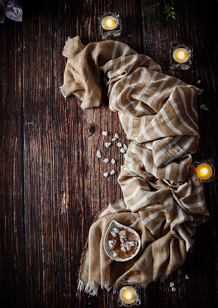 Macchiato Scarf with candles on wooden background 