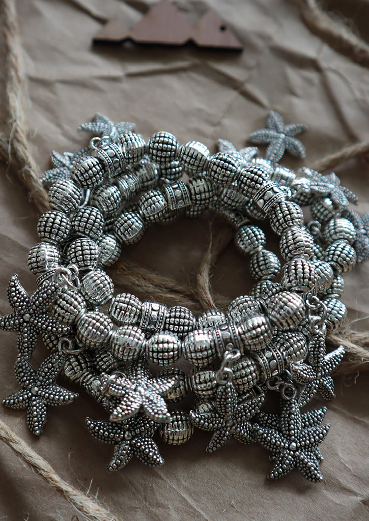 three Starfish Bracelets on Kraft paper background 